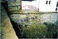 Instandsetzung einer Natursteinmauer.
